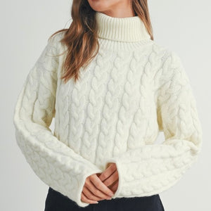 CUDDLE ME IN WHITE CABLE KNIT TURTLENECK SWEATER